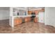 Spacious kitchen with stainless steel dishwasher, oven, microwave, and ample countertop space perfect for cooking at 12425 W Willow Ave Ave, El Mirage, AZ 85335