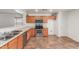 The kitchen features stainless steel appliances, a breakfast bar, and plenty of natural light at 12425 W Willow Ave Ave, El Mirage, AZ 85335