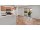 Bright kitchen featuring stainless steel appliances, light wood cabinetry, and sliding door access to the backyard at 12425 W Willow Ave Ave, El Mirage, AZ 85335
