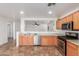 Bright and airy kitchen with stainless steel appliances and breakfast bar that opens up to the living area at 12425 W Willow Ave Ave, El Mirage, AZ 85335