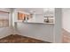 Cozy kitchen area with wood cabinetry and an open breakfast bar at 12425 W Willow Ave Ave, El Mirage, AZ 85335