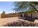 Spacious backyard featuring a hammock and patio set, offering a relaxing outdoor space at 13041 N 51St Dr, Glendale, AZ 85304