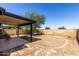 The backyard features a covered patio, hammock, and patio furniture, perfect for relaxation and entertaining at 13041 N 51St Dr, Glendale, AZ 85304