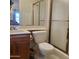 Bathroom features a sink, toilet and sliding glass door shower at 13041 N 51St Dr, Glendale, AZ 85304