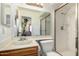 Bathroom featuring a glass shower stall, white tile, and a vanity sink at 13041 N 51St Dr, Glendale, AZ 85304