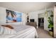 Cozy bedroom featuring a wall mural and closet access at 13041 N 51St Dr, Glendale, AZ 85304