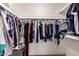 Walk-in closet with an abundance of hanging storage for clothing at 13041 N 51St Dr, Glendale, AZ 85304