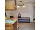 A dining room setting with a dining table and view to what seems to be an office space at 13041 N 51St Dr, Glendale, AZ 85304