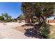 Welcoming single-story home with brick accents, two-car garage, mature trees and landscaping at 13041 N 51St Dr, Glendale, AZ 85304