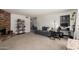 Spacious living room featuring a brick fireplace, cozy seating, and ample room for a home office at 13041 N 51St Dr, Glendale, AZ 85304
