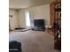 Comfortable living room featuring a fireplace and a large television at 13041 N 51St Dr, Glendale, AZ 85304