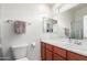 This serene bathroom includes a well-lit mirror and neutral wall color at 1350 S Greenfield Rd # 1005, Mesa, AZ 85206