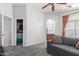 Spacious bedroom featuring plush gray carpeting and access to an ensuite bathroom and walk-in closet at 1350 S Greenfield Rd # 1005, Mesa, AZ 85206
