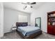 Bedroom features a comfortable bed, bedside table, and large window providing natural light at 1350 S Greenfield Rd # 1005, Mesa, AZ 85206