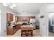 Modern kitchen with stainless steel appliances, granite countertops, and a cozy central island at 1350 S Greenfield Rd # 1005, Mesa, AZ 85206