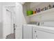 Convenient laundry room with washer, dryer, and ample shelving for storage at 1350 S Greenfield Rd # 1005, Mesa, AZ 85206
