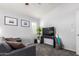 Inviting living room features neutral decor, plush carpet, and a modern TV setup at 1350 S Greenfield Rd # 1005, Mesa, AZ 85206
