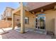 An expansive patio area with neutral walls, featuring a covered space and sliding glass doors for indoor-outdoor living at 1350 S Greenfield Rd # 1005, Mesa, AZ 85206