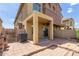 View of a patio with brick pavers, covered seating area and access to the house through a sliding glass door at 1350 S Greenfield Rd # 1005, Mesa, AZ 85206