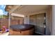 Private outdoor hot tub under covered patio, ideal for relaxation, with easy access to the home at 14952 W Maui Ln, Surprise, AZ 85379
