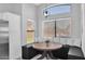 Charming breakfast nook features a built-in bench with decorative pillows and a modern light fixture at 14952 W Maui Ln, Surprise, AZ 85379
