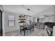 Dining room with modern light fixture, decorative shelving, and open layout at 14952 W Maui Ln, Surprise, AZ 85379