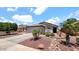 Charming home featuring low maintenance desert landscaping and a tile roof at 14952 W Maui Ln, Surprise, AZ 85379