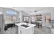 Kitchen featuring a breakfast nook, an island, and a dining table at 14952 W Maui Ln, Surprise, AZ 85379
