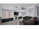 Inviting living room featuring a fireplace, media center, and comfortable seating at 14952 W Maui Ln, Surprise, AZ 85379