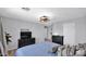 Serene main bedroom featuring a ceiling fan, dresser, and ensuite bathroom at 14952 W Maui Ln, Surprise, AZ 85379