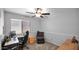 Home office featuring a desk, comfortable chair, and natural light at 14952 W Maui Ln, Surprise, AZ 85379