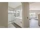 Modern bathroom featuring double vanity, updated fixtures and a walk-in glass shower with beautiful marble tile surround at 15411 W Amelia Dr, Goodyear, AZ 85395