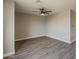 Spacious bedroom with wood floors and a ceiling fan at 15411 W Amelia Dr, Goodyear, AZ 85395