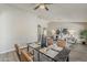 Dining room featuring a stylish table set near a modern living space at 15411 W Amelia Dr, Goodyear, AZ 85395