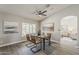 Modern dining room with stylish table set and views to outdoor area at 15411 W Amelia Dr, Goodyear, AZ 85395