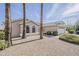 Beautiful home with desert landscaping, featuring gravel ground cover and mature palm trees at 15411 W Amelia Dr, Goodyear, AZ 85395