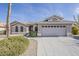 Charming single-story home with a well-manicured yard and a spacious two-car garage at 15411 W Amelia Dr, Goodyear, AZ 85395