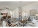 Open living and dining area with modern decor, light wood floors, and plenty of natural light at 15411 W Amelia Dr, Goodyear, AZ 85395