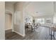 Open-concept living room with archways, wood-look floors, and a large window for natural light at 15411 W Amelia Dr, Goodyear, AZ 85395