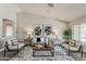 Contemporary living room with modern decor, neutral walls, and stylish seating arrangement at 15411 W Amelia Dr, Goodyear, AZ 85395