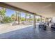 Covered patio with desert landscaping and an outdoor seating area at 15411 W Amelia Dr, Goodyear, AZ 85395