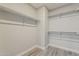 Walk-in closet boasting ample storage space, shelving units, and practical layout to meet your storage needs at 15411 W Amelia Dr, Goodyear, AZ 85395