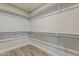 Large walk-in closet boasting ample storage space, shelving units, and practical layout to meet your storage needs at 15411 W Amelia Dr, Goodyear, AZ 85395