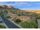 Aerial view of desert neighborhood featuring multi-story homes, desert landscaping and mountain views at 16401 S 29Th Ave, Phoenix, AZ 85045