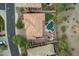 An aerial view of a backyard boasting a pool, spa, built-in barbecue, and landscaped yard at 16401 S 29Th Ave, Phoenix, AZ 85045