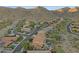 Scenic community featuring houses with private pools and beautifully landscaped yards against a mountain backdrop at 16401 S 29Th Ave, Phoenix, AZ 85045
