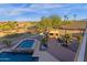 Private backyard oasis features a pool, spa, outdoor kitchen, and desert landscaping at 16401 S 29Th Ave, Phoenix, AZ 85045