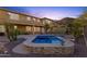 Backyard features an inviting pool, covered patio with seating, and a mountain view at 16401 S 29Th Ave, Phoenix, AZ 85045