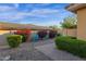 View of a backyard featuring flowering bushes, brick landscaping and play equipment at 16401 S 29Th Ave, Phoenix, AZ 85045