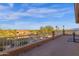 Second story balcony overlooks the pool, landscaped grounds and surrounding mountain views at 16401 S 29Th Ave, Phoenix, AZ 85045